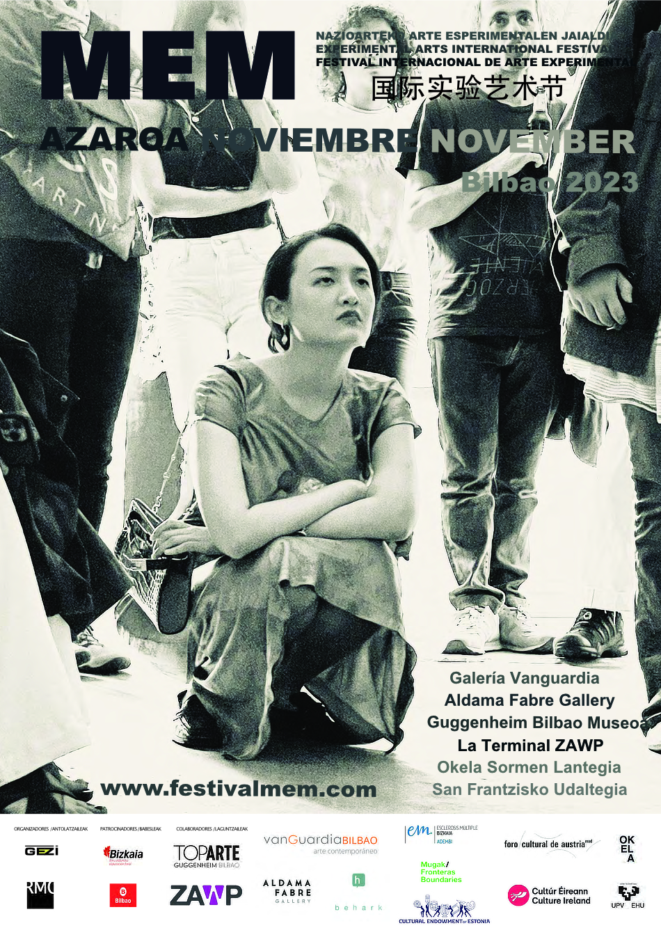 MEM Festival Poster, A person is crouched on the ground there are other people around them, they are watching a performance